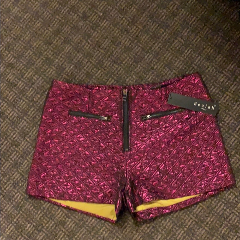 Sexy. Reddish fuschia. Zip front.